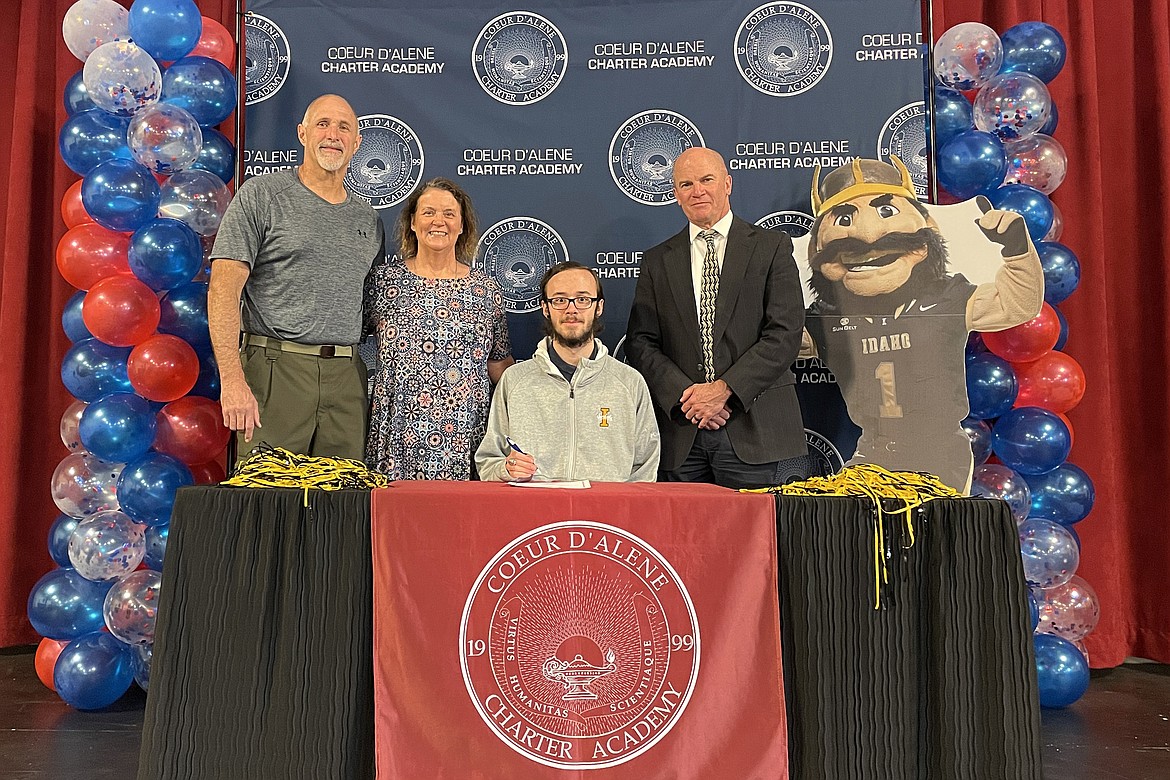 Coeur d'Alene Charter Academy senior Dalton Altimus signed a letter of intent to attend the University of Idaho in Moscow. Pictured are Scott and Mary Altimus, Dalton and Charter Principal Dan Nicklay.