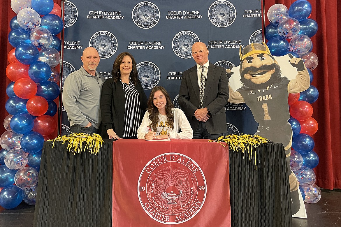 Coeur d'Alene Charter Academy senior Taylor Peterson signed a letter of intent to attend the University of Idaho in Moscow. Pictured are Kenneth and Sharman Peterson, Taylor and Charter Principal Dan Nicklay.