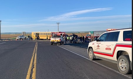 First responders are on the scene of an accident near George. The bus in the photo above is a retired school bus that was being used to transport