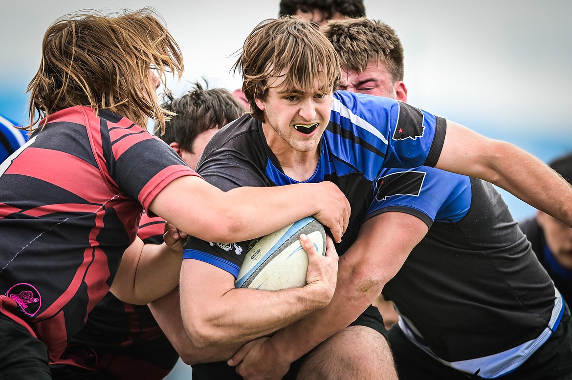Flathead Valley Black and Blue's Luke Leech (4) is stopped just short of a try against the Missoula Mud Dogs during the championship game of the State Rugby Tournament at Glacier High School on Saturday, May 14. (Casey Kreider/Daily Inter Lake)