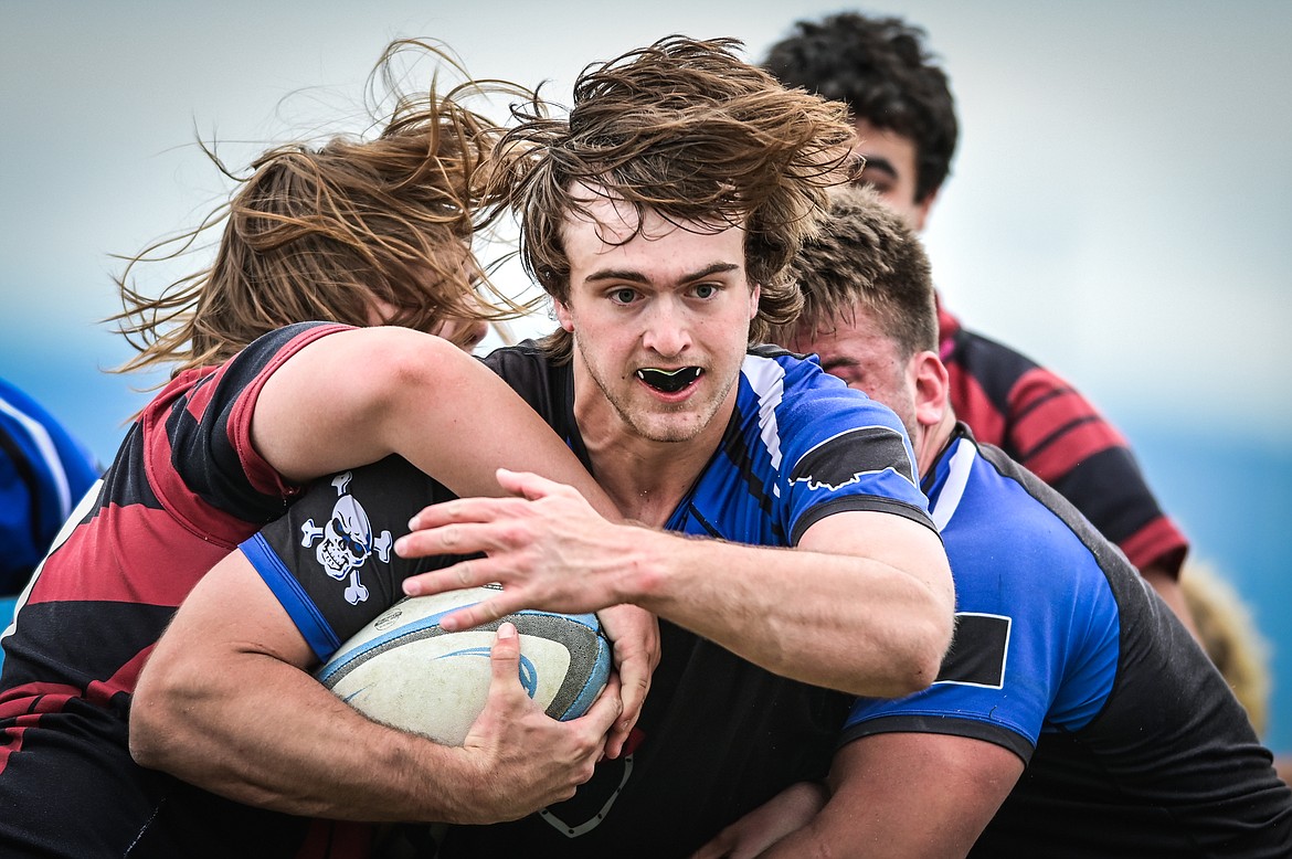 Flathead Valley Black and Blue's Luke Leech (4) is stopped just short of a try against the Missoula Mud Dogs during the championship game of the State Rugby Tournament at Glacier High School on Saturday, May 14. (Casey Kreider/Daily Inter Lake)