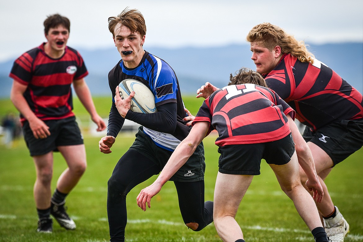 Flathead Valley Black and Blue's Sawyer Troupe (13)  is stopped just short of a try against the Missoula Mud Dogs during the championship game of the State Rugby Tournament at Glacier High School on Saturday, May 14. (Casey Kreider/Daily Inter Lake)