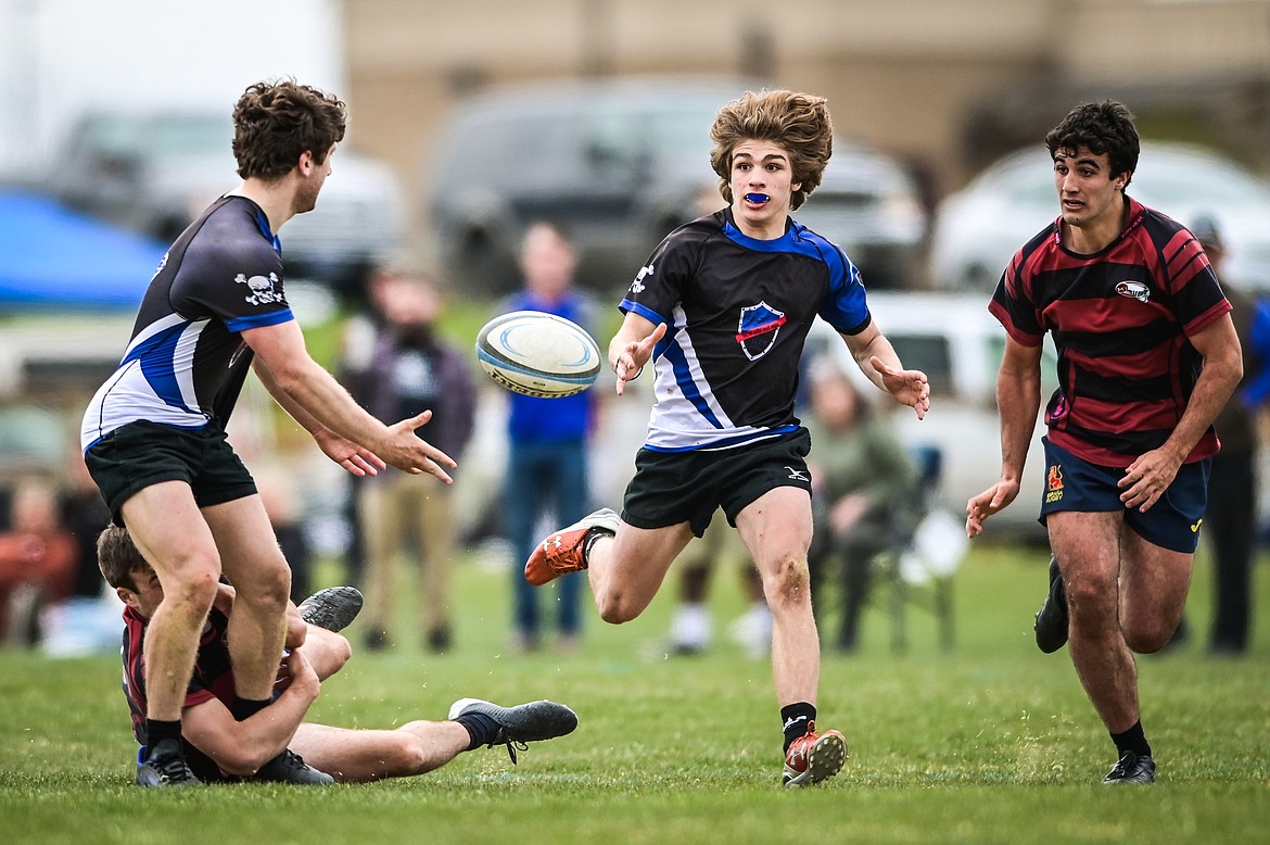 Flathead Valley Black and Blue's Fin Nadeau (9) passes to a teammate during the championship game of the State Rugby Tournament against the Missoula Mud Dogs at Glacier High School on Saturday, May 14. (Casey Kreider/Daily Inter Lake)