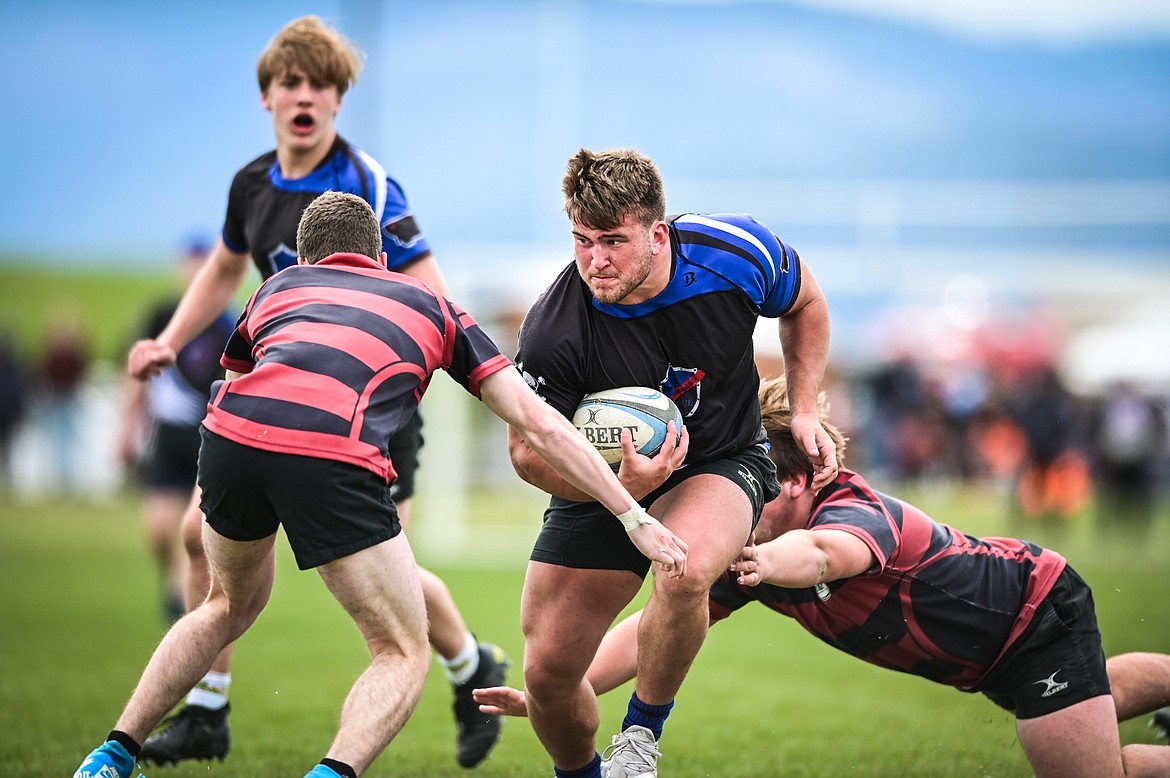 Flathead Valley Black and Blue's Jake Rendina (1) runs with the ball against the Missoula Mud Dogs during the championship game of the State Rugby Tournament at Glacier High School on Saturday, May 14. (Casey Kreider/Daily Inter Lake)