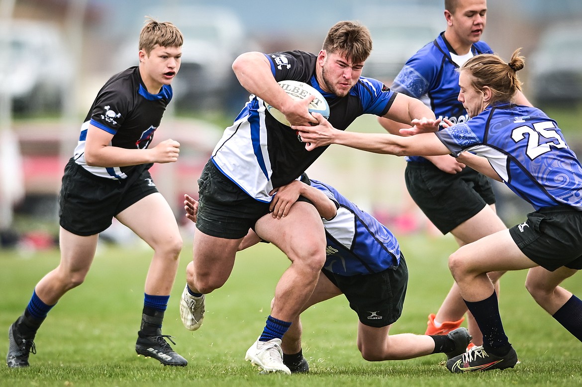 Flathead Valley Black and Blue's Jake Rendina (1) runs with the ball against the Helena Hooligans in the semifinals of the State Rugby Tournament at Glacier High School on Saturday, May 14. (Casey Kreider/Daily Inter Lake)