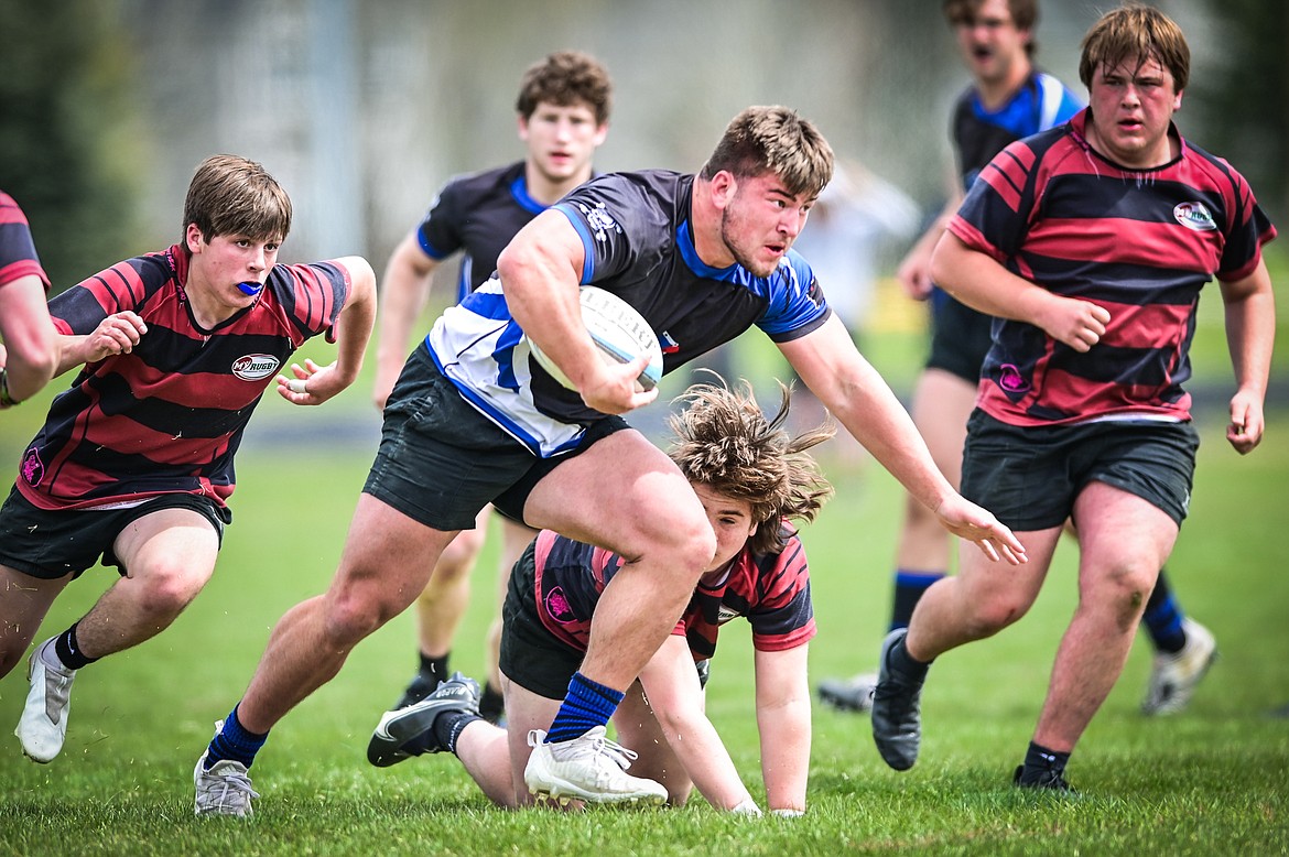 Flathead Valley Black and Blue's Jake Rendina (1) runs with the ball against the Helena Hooligans in the semifinals of the State Rugby Tournament at Glacier High School on Saturday, May 14. (Casey Kreider/Daily Inter Lake)