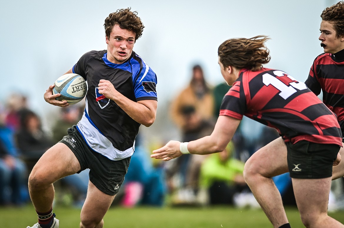 Flathead Valley Black and Blue's Wyatt Thomason (6) breaks free for a run against the Missoula Mud Dogs during the championship game of the State Rugby Tournament at Glacier High School on Saturday, May 14. (Casey Kreider/Daily Inter Lake)