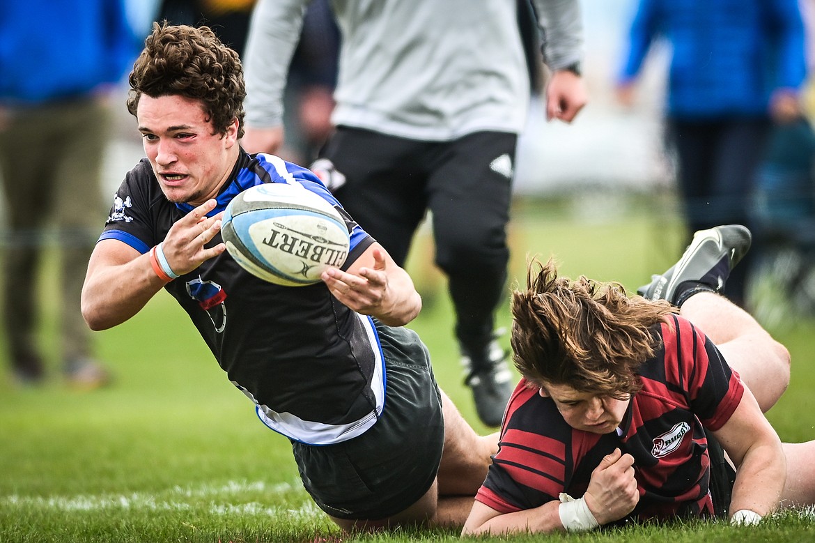Flathead Valley Black and Blue's Wyatt Thomason (6) reaches for a try against the Missoula Mud Dogs during the championship game of the State Rugby Tournament at Glacier High School on Saturday, May 14. (Casey Kreider/Daily Inter Lake)