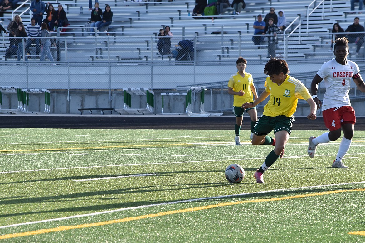 QHS junior Antonio Valadez (14) kicks to score the only goal for the Jacks during the district matchup against Cascade on Saturday. The game was tight with both the Jacks and Kodiaks having beaten one another by a single goal margin at least once previously in the season.