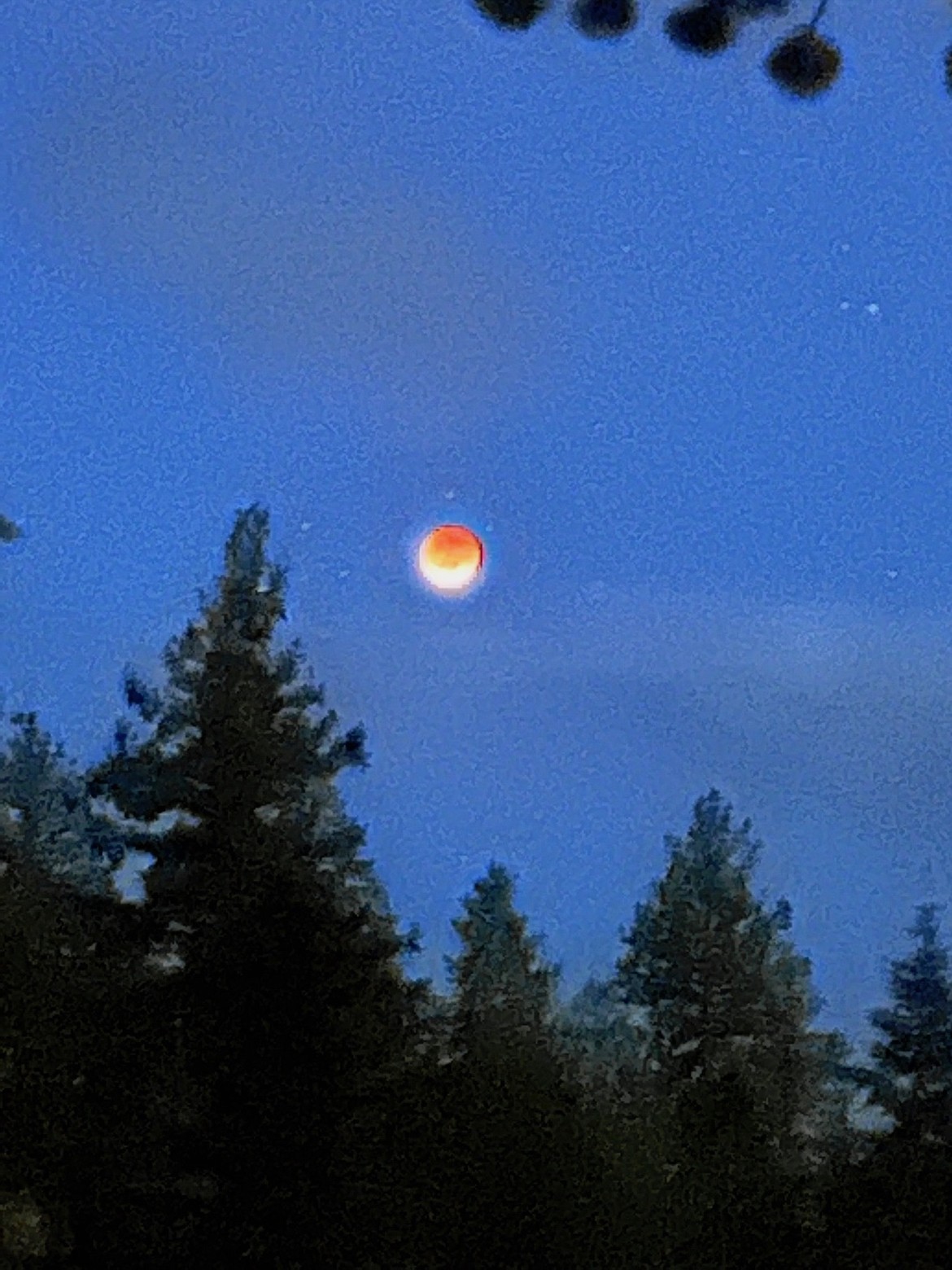The clouds broke free around 9:45 p.m. Sunday for a short while right at the full lunar eclipse.