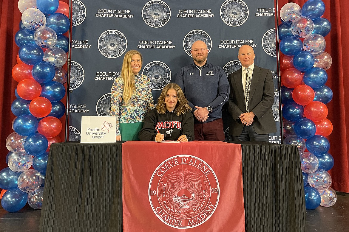 Coeur d'Alene Charter Academy senior Skylar Carothers signed a letter of intent to attend Pacific University in Forest Grove, Ore. Pictured are Charter teacher Dana Fleming, Skylar, soccer Coach Trey Weatherly and Principal Dan Nicklay.