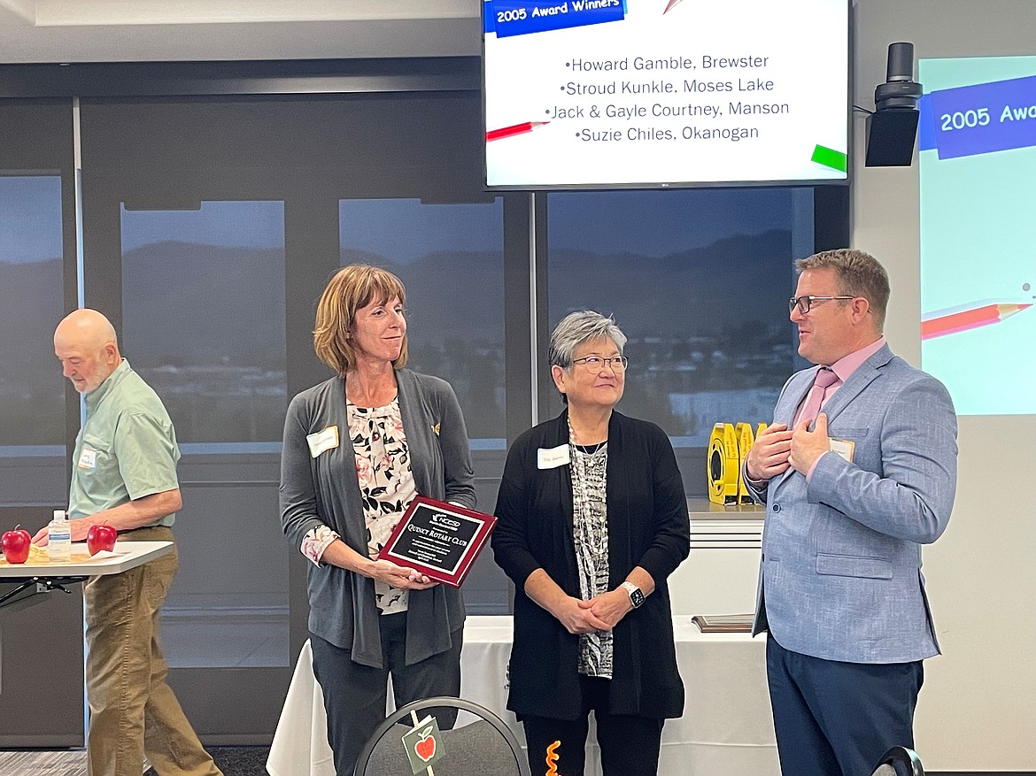 Rotary Club of Quincy members Melva Calloway (left) and Debra Adams (center) accept a Friend of Children award from the North Central Education Service District May 12. The club was nominated for recognition by Quincy superintendent Nik Bergman (right).