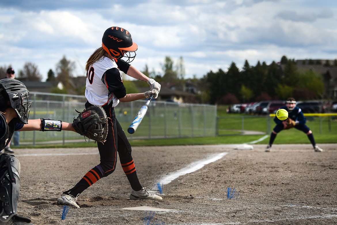 Flathead's Macy Craver (30) connects on a single in the first inning against Glacier at Kidsports Complex on Tuesday, May 17. (Casey Kreider/Daily Inter Lake)