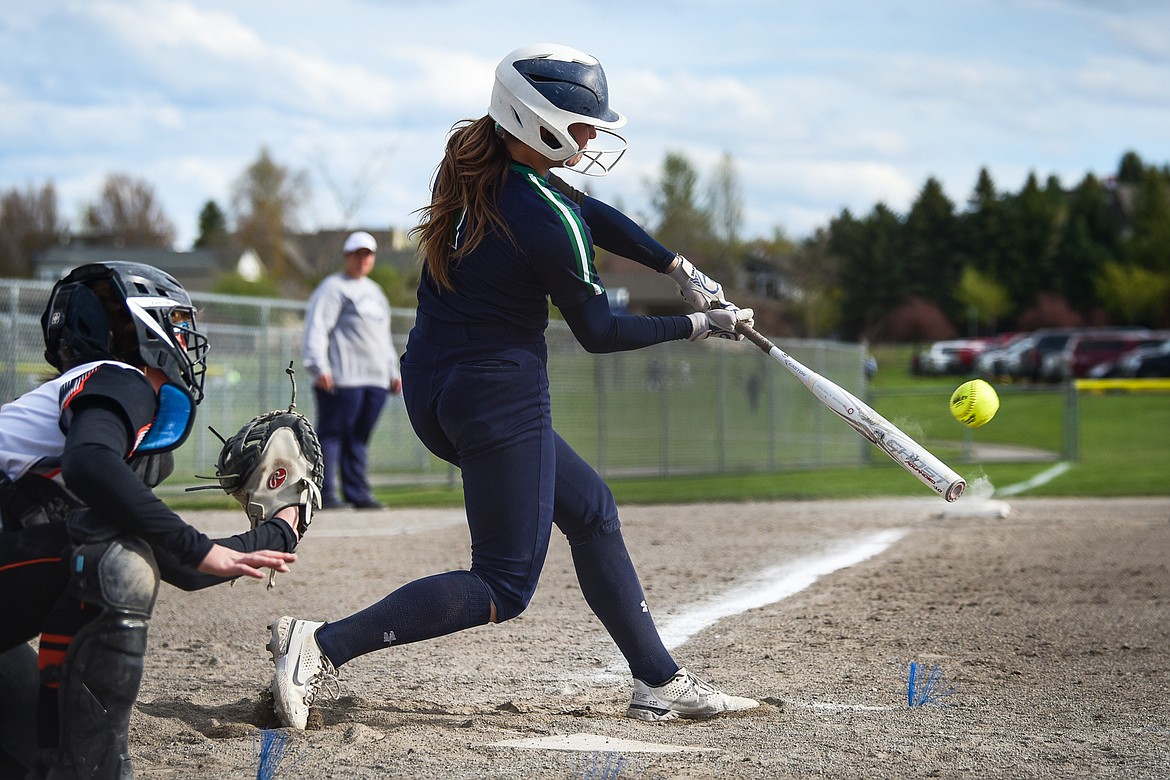 Glacier's Sammie Labrum (1) connects on a two-run home run against Flathead at Kidsports Complex on Tuesday, May 17. (Casey Kreider/Daily Inter Lake)