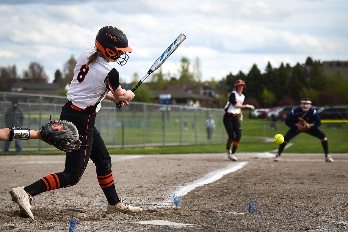 Flathead's Mackenzie Brandt (8) connects on a three-run single against Glacier at Kidsports Complex on Tuesday, May 17. (Casey Kreider/Daily Inter Lake)