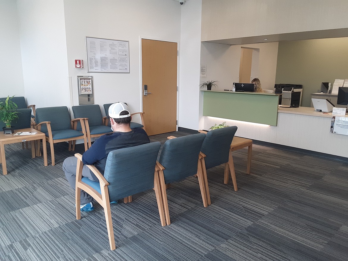 A patient sits in the waiting room of the occupational medicine department at the Samaritan Clinic on Patton Boulevard. The department is the latest to open at the clinic.