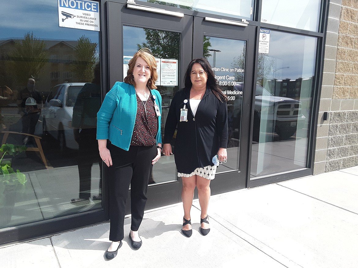 Carrie Barr, executive director of clinics for Samaritan Healthcare, and LaDonna Chambard, clinic operations manager for Samaritan, stand outside the expanded Samaritan Clinic on Patton Boulevard Monday. The clinic recently added an occupational medicine department and moved urgent care to a larger space.