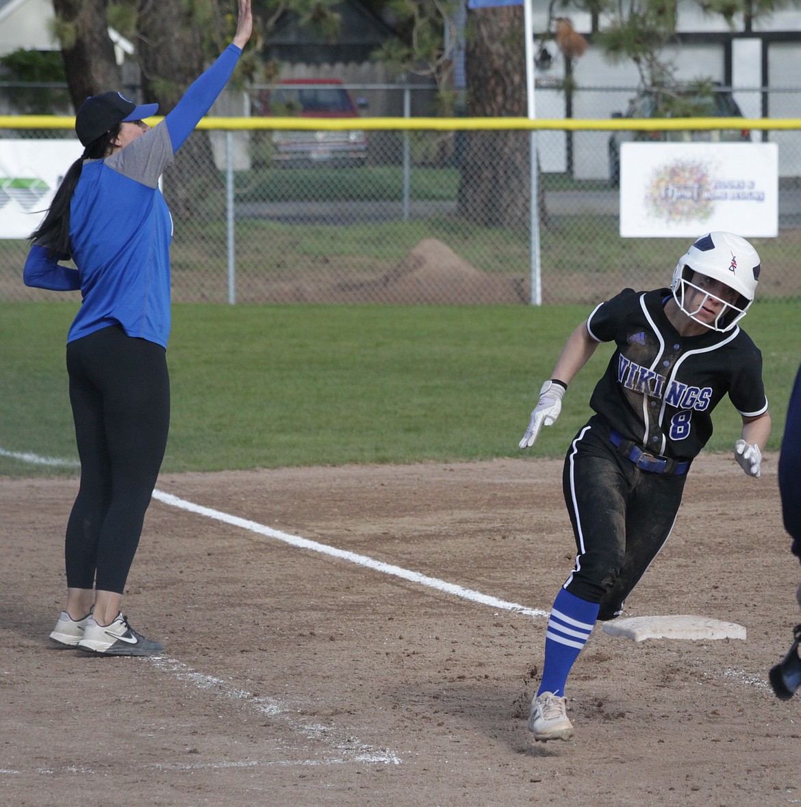 MARK NELKE/Press
Alexis Blankenship (8) of Coeur d'Alene rounds third base and heads for home, as Viking coach Bobbi Darretta motions to the next baserunner during last week's 5A Region 1 softball championship victory over Lewiston.