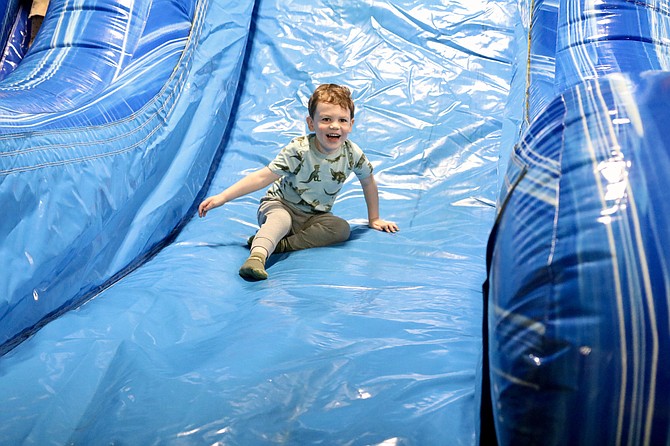 Kolby Porria, 3, visits his favorite bounce house at Jump for Joy with his grandparents.