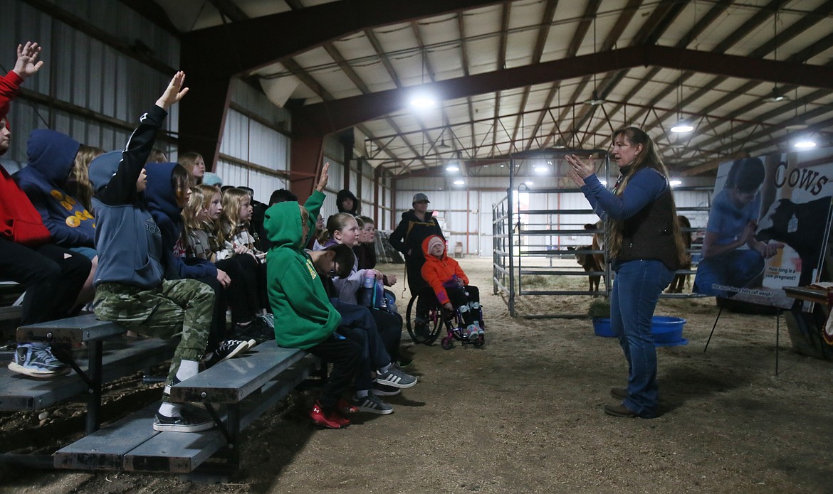 Sharla Wilson asks fifth-graders questions about cows during a Farm to Table day at the Kootenai County Fairgrounds on Wednesday morning.