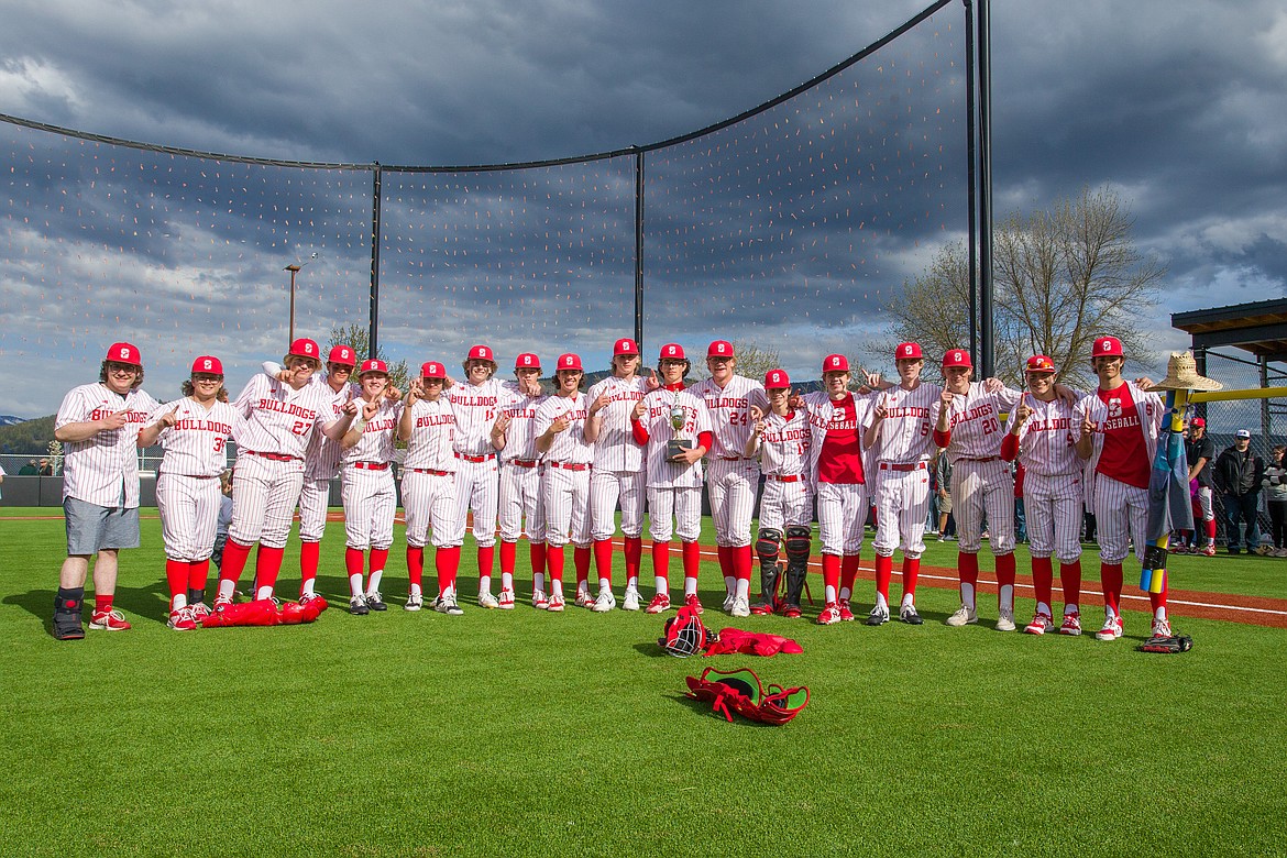 The Sandpoint baseball team poses for a picture following its Class 4A district 1 championship victory against Moscow.