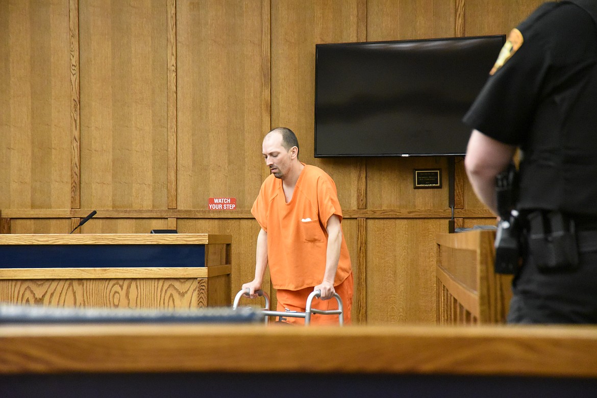 Grant Alan West makes his way to the defendant's table in Flathead District Court on Thursday, May 19, 2022. He was arraigned on felony charges of aggravated kidnapping, robbery and criminal possession of dangerous drugs. (Derrick Perkins/Daily Inter Lake)