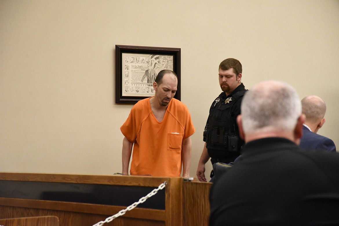 Grant Alan West takes a seat at the defendant's table in Flathead District Court on Thursday, May 19, 2022. He was arraigned on felony charges of aggravated kidnapping, robbery and criminal possession of dangerous drugs. (Derrick Perkins/Daily Inter Lake)