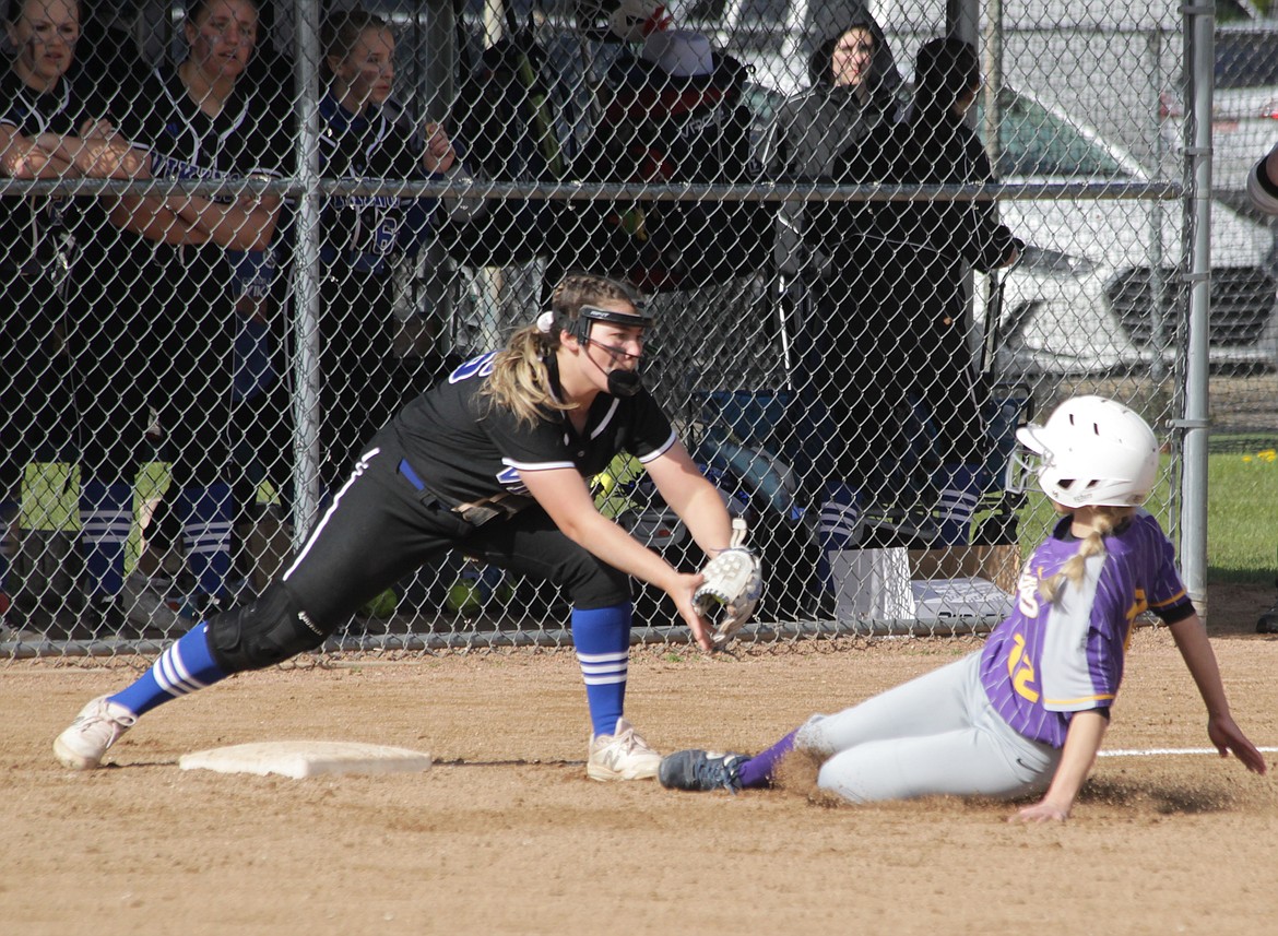 MARK NELKE/Press
Coeur d'Alene High third baseman Catherine Bakken tags out a Lewiston runner during last week's 5A Region 1 softball championship game.