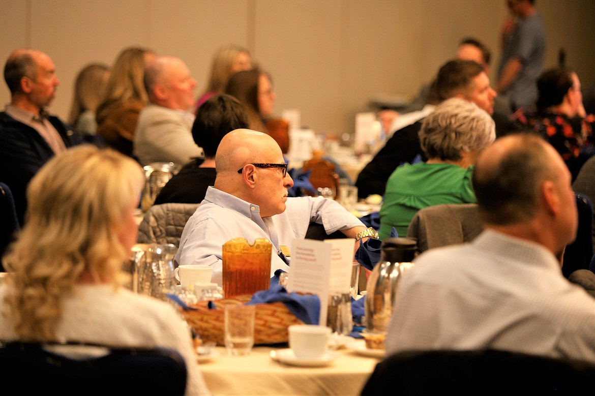 Audience members listen to economist Robert Dietz during the North Idaho Building Contractors Association's Regional Economic Summit at The Coeur d'Alene Resort on Thursday.