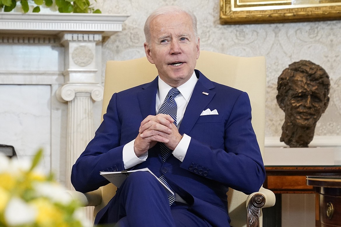President Joe Biden sits in the Oval Office of the White House, on March 4, 2022, in Washington. A “Billionaire Minimum Income Tax” included in President Joe Biden’s proposed budget for the next fiscal year is part of the administration’s larger effort to reduce the federal deficit over the next decade. The White House says the proposal would eliminate the “sheltering of income for decades or generations.” (AP Photo/Patrick Semansky, File)