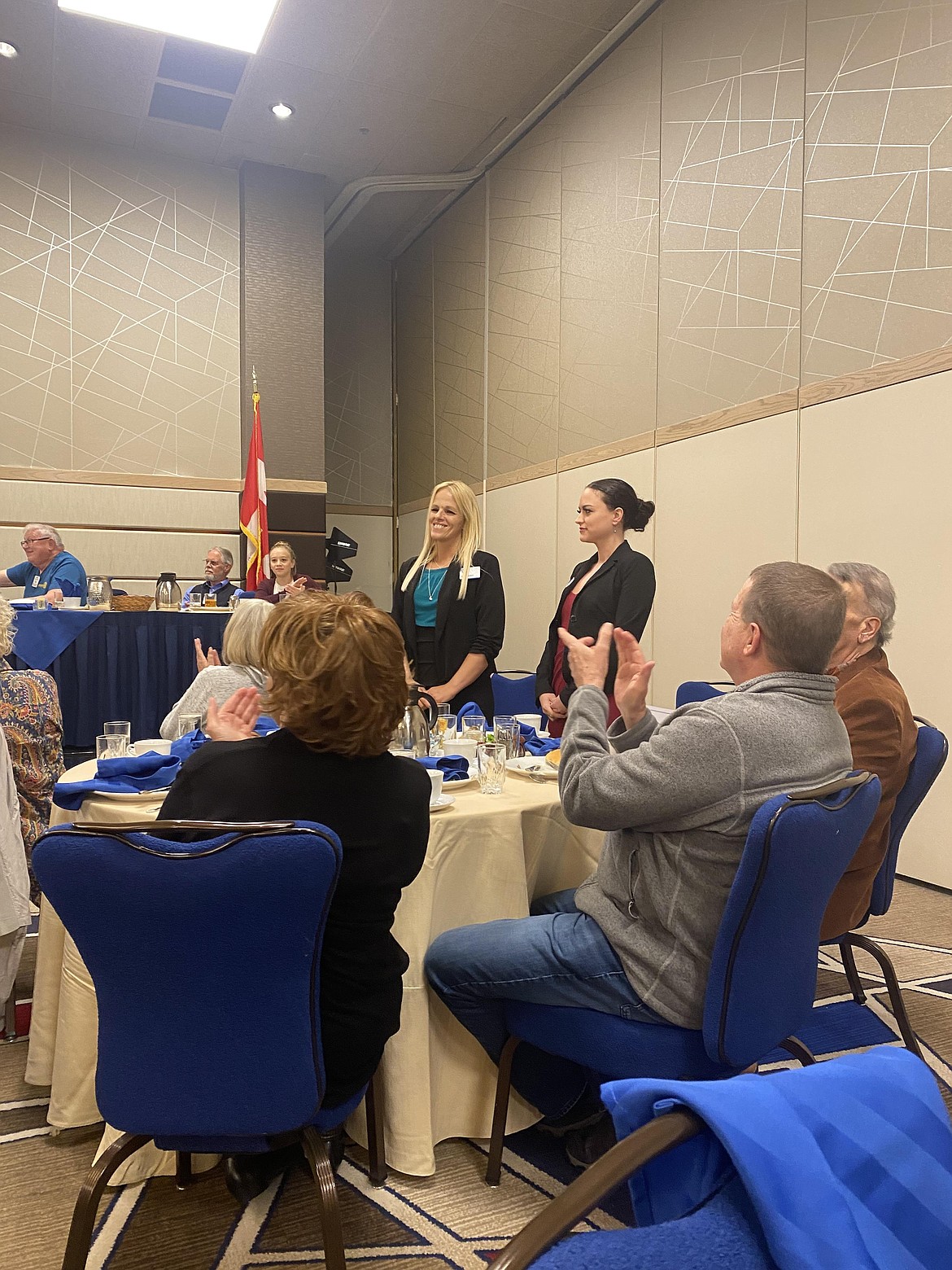 Annie Parker (left) and Kendra Wininger, case managers with St. Vincent de Paul North Idaho stand to receive a Rotary Foundation grant Friday at the Coeur d'Alene Resort. Rotary awarded more than $31,000 to about 20 local nonprofit organizations.