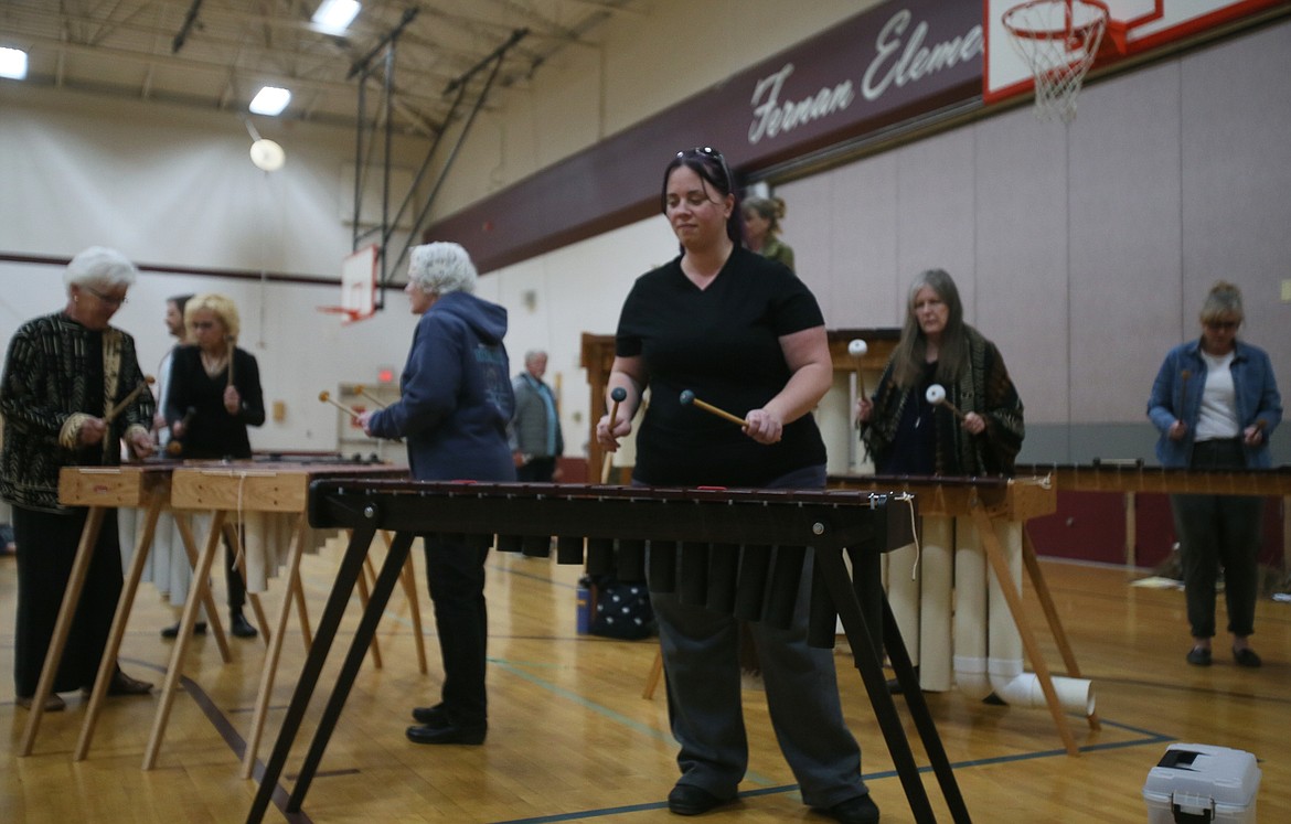 Tami Vandegrift, front, and her Coeurimba colleagues play uplifting marimba music in the Fernan STEM Academy gym.