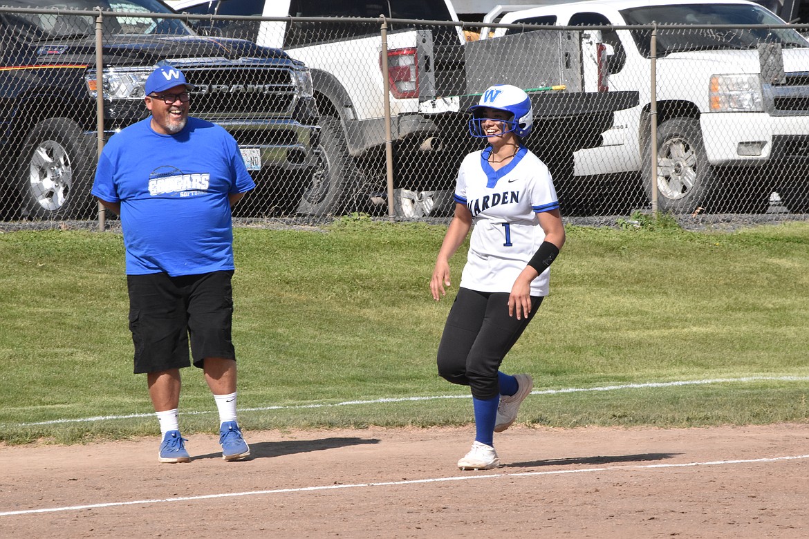 Cutline Warden head coach Randy Wright looks on as senior Kiana Rios celebrates a home run. That trip across the plate was one of many small victories that helped the Lady Cougars on their trip to state competition.
