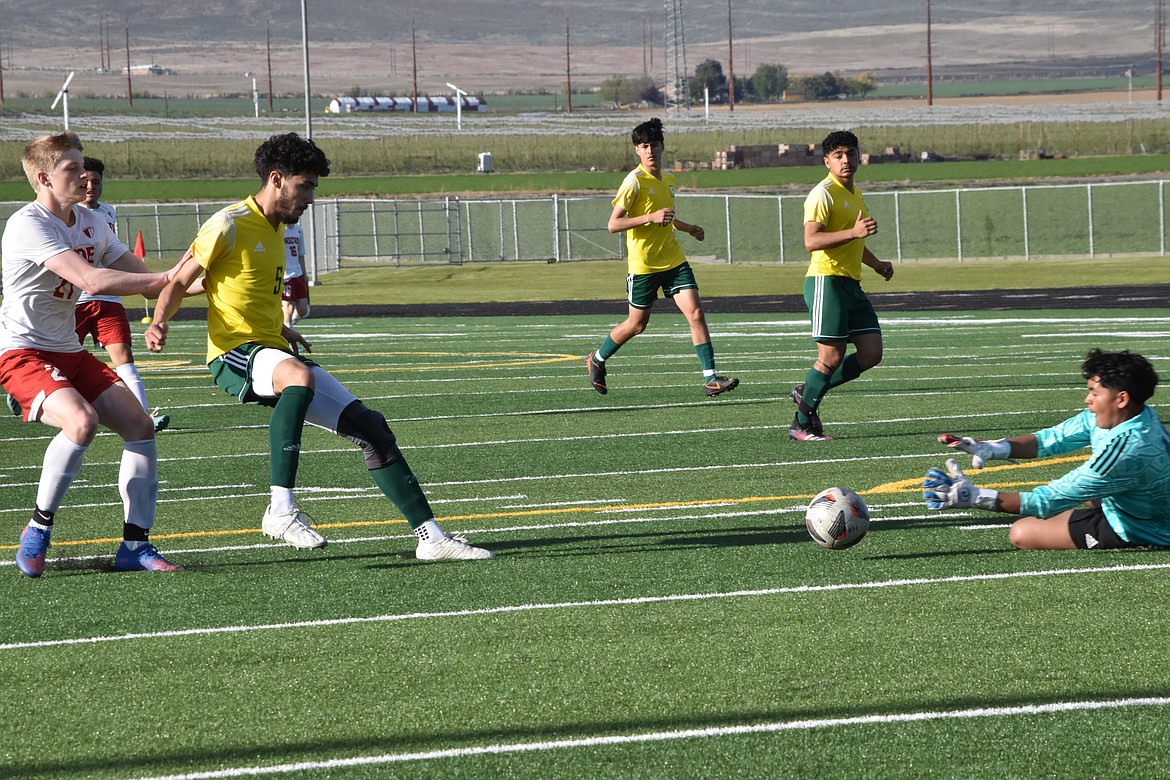 Quincy High School goalkeeper Romualdo Sandoval makes a save during the matchup against Chelan on May 14.