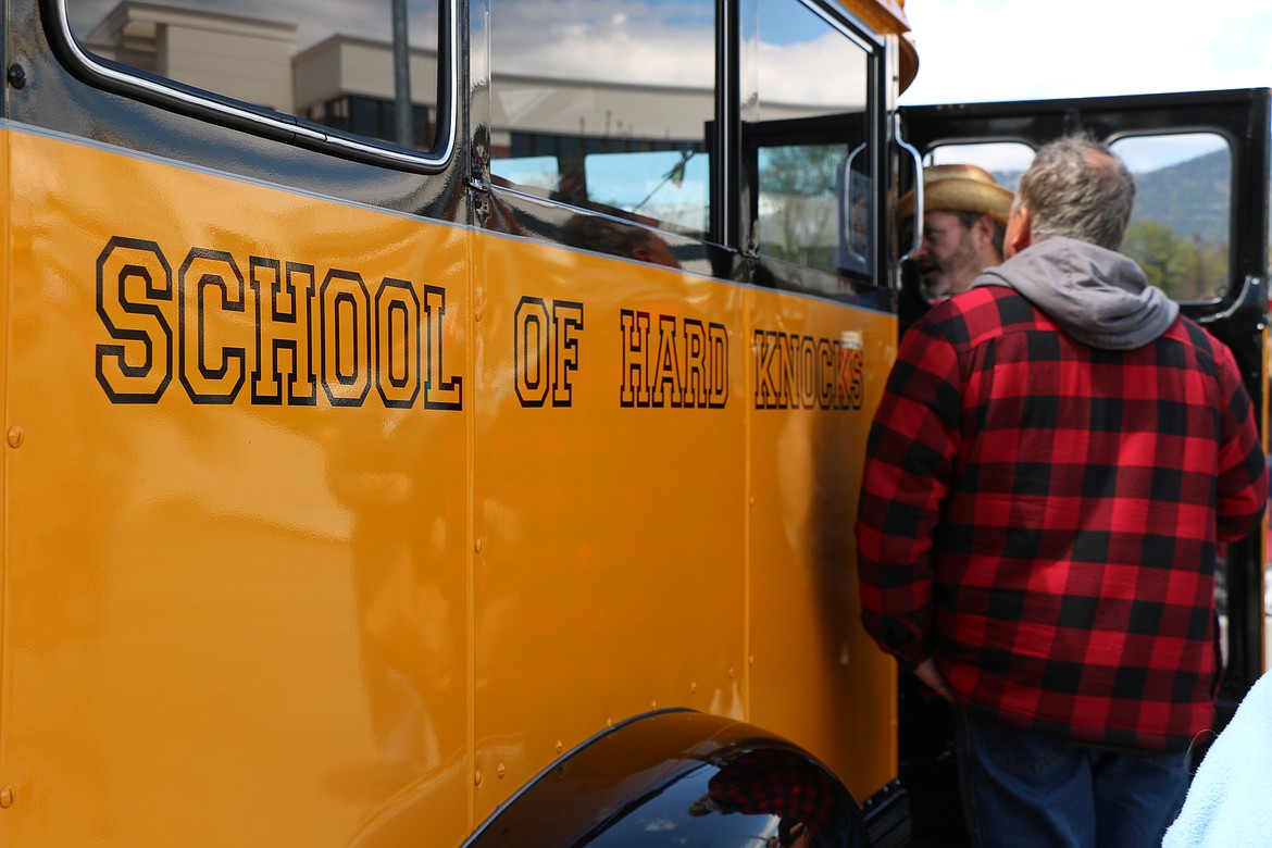 A pair check out an out an old school bus Saturday during Lost in the '50s 
as the classic car show returned for its 35th anniversary.