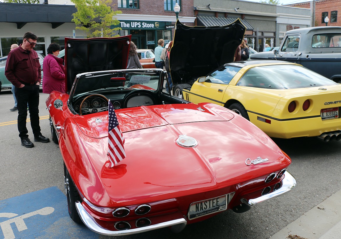 A classic car fan checks out a vintage Chevy Corvette owned by Jack and Sherri Learn of Hayden. He was just one of the thousands of fans to pack the streets of downtown Sandpoint as Lost in the '50s returned for its 35th anniversary following a two-year hiatus due to the pandemic.
