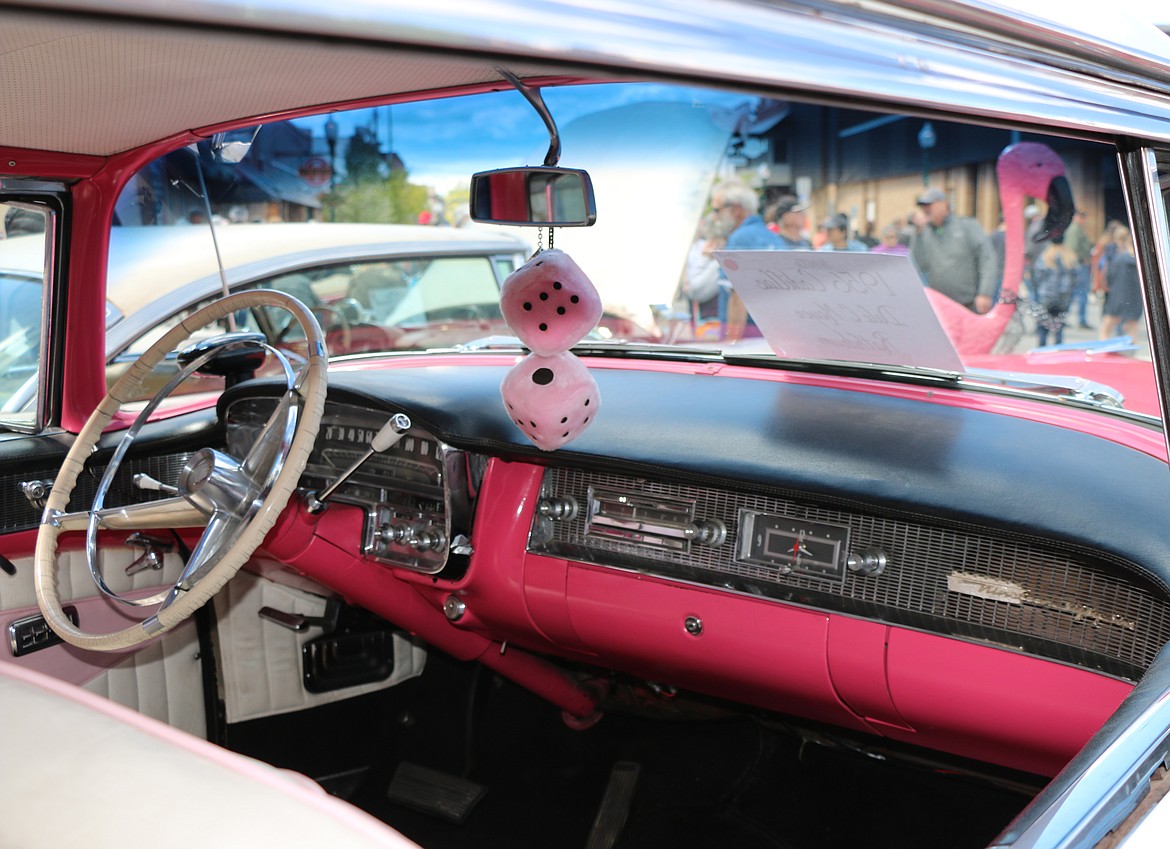 Pink dice and a large plastic flamingo decorate a car at the 35th annual Lost in the '50s car show in Sandpoint on Saturday.