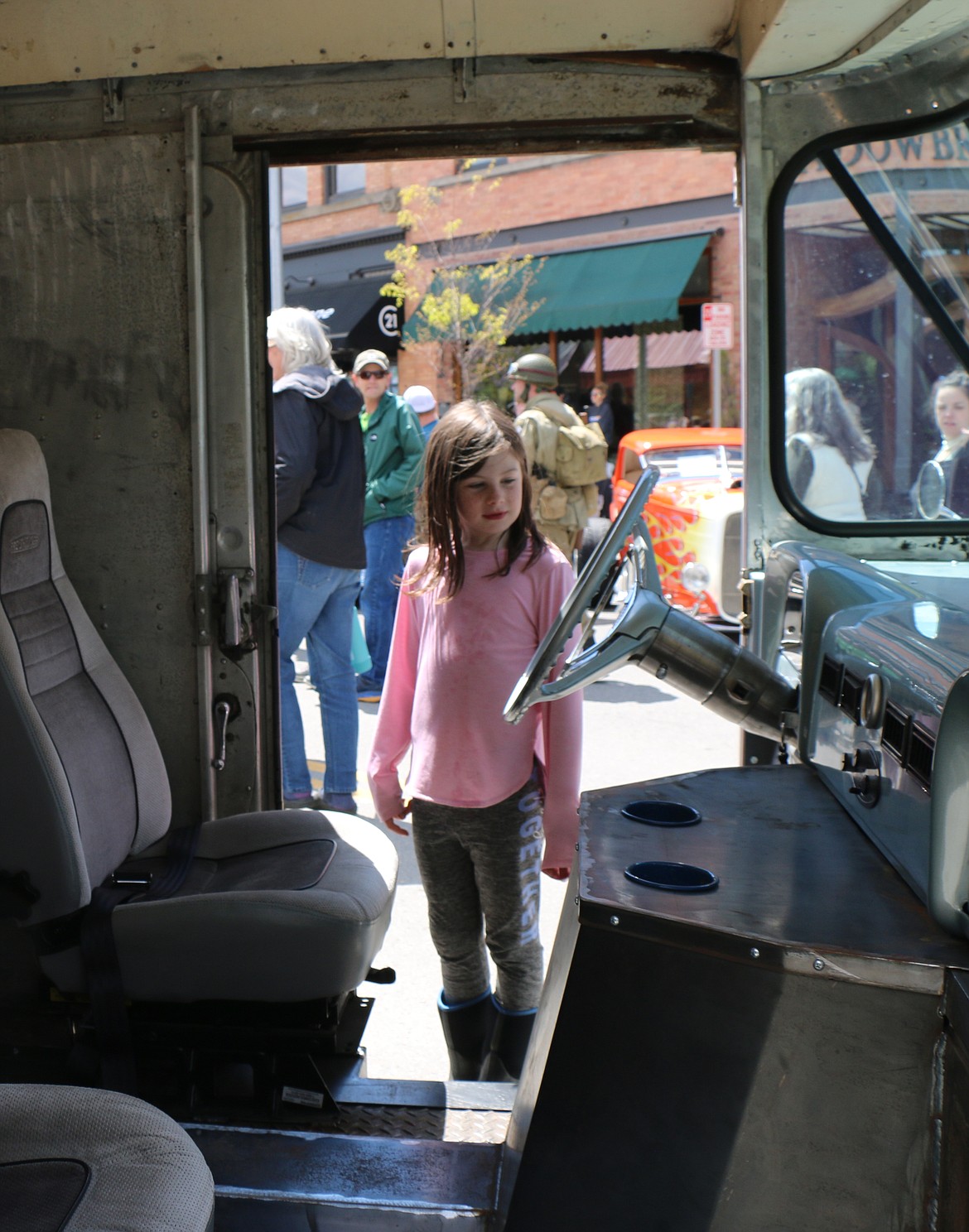 A youngster checks out the inside of a classic vehicle at the Lost in the '50s car show on Saturday.