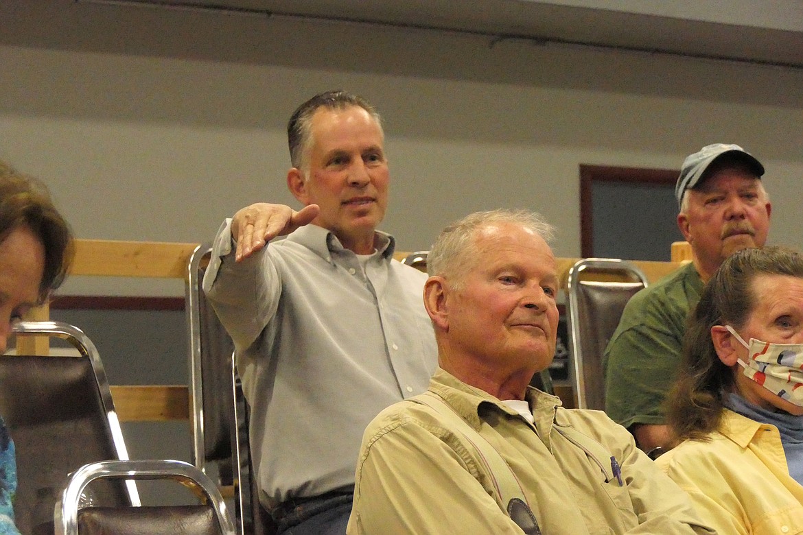 Sanders County Commissioner Tony Cox (left) tells those in attendance at the Sewer Board meeting the County is ready to step in and take control of the hotly contested sewer project as Thompson Falls Mayor Mark Sheets (top right) and interim County Commissioner Claude Burlingame (front) listen. (Chuck Bandel/VP-MI)