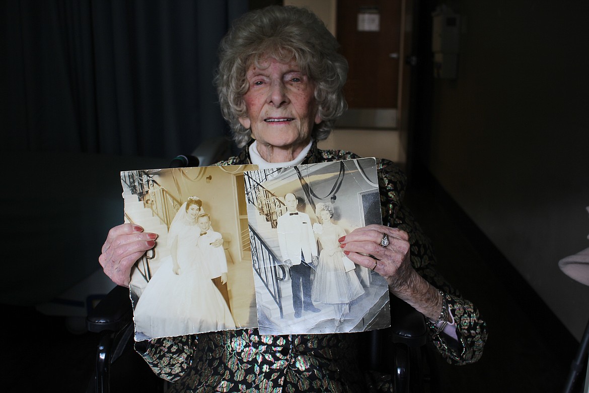 Wendy Mills, who will be 105 on Saturday, July 2, holds pictures of her only daughter and her grandson along with a picture of her husband on their wedding day. She has been a resident of Mineral Community Hospital for almost 2 years.