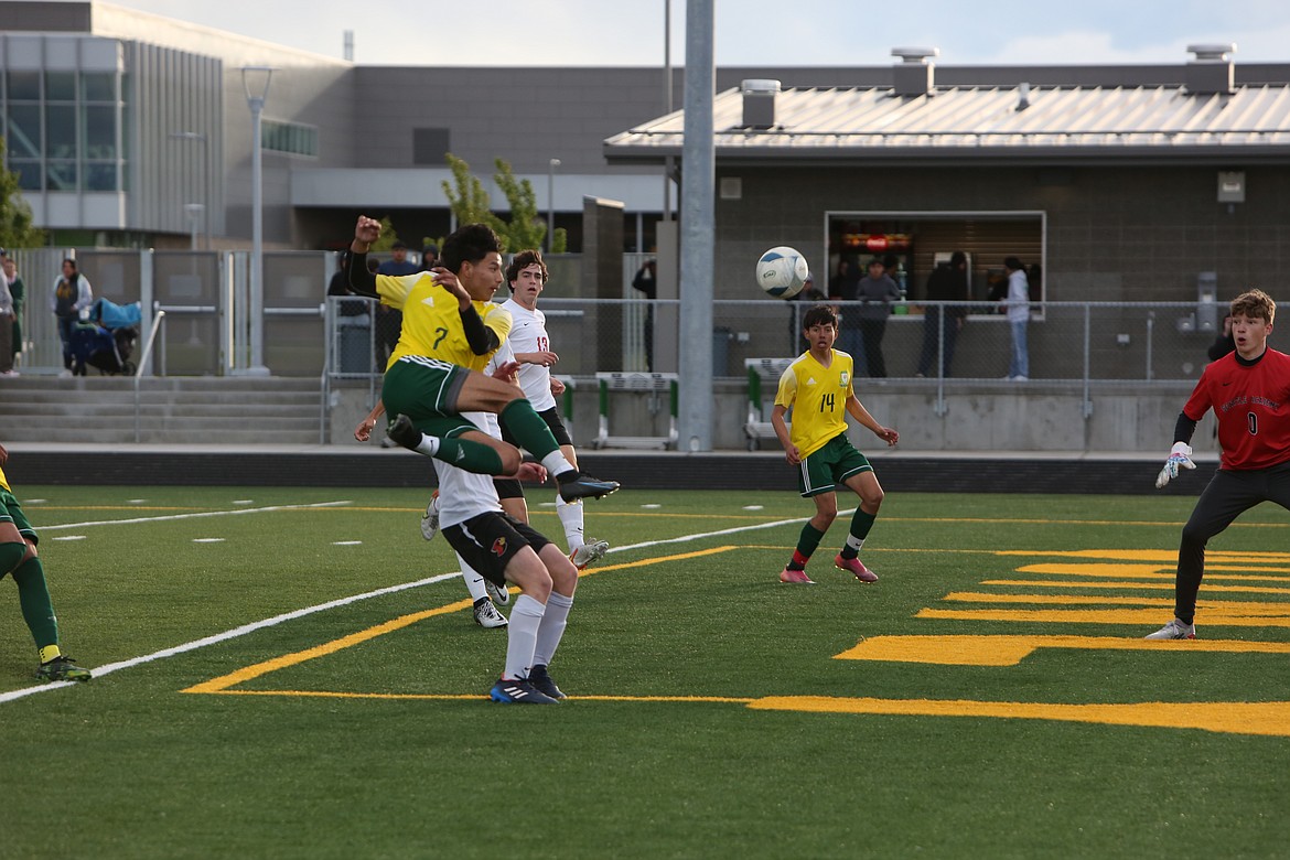 Quincy’s David Carillo jumps in the air while taking a shot on the net in Quincy’s 3-2 loss to Seattle Academy on May 20, 2022.