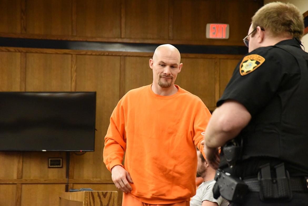 Aaron Martin McGarry heads to the defendant's table in Flathead County District Court on Thursday, May 18. McGarry faces felony strangulation and theft charges. (Derrick Perkins/Daily Inter Lake)