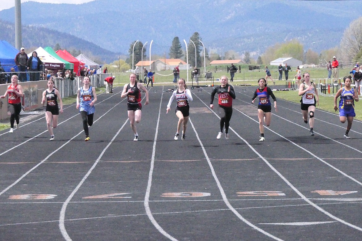 Katelyn Christensen of Hot Springs (fourth from the left) nears the finish line in the girls 100 meters final. Superior's Isabella Pereira is third from the right. (Chuck Bandel/MI-VP)