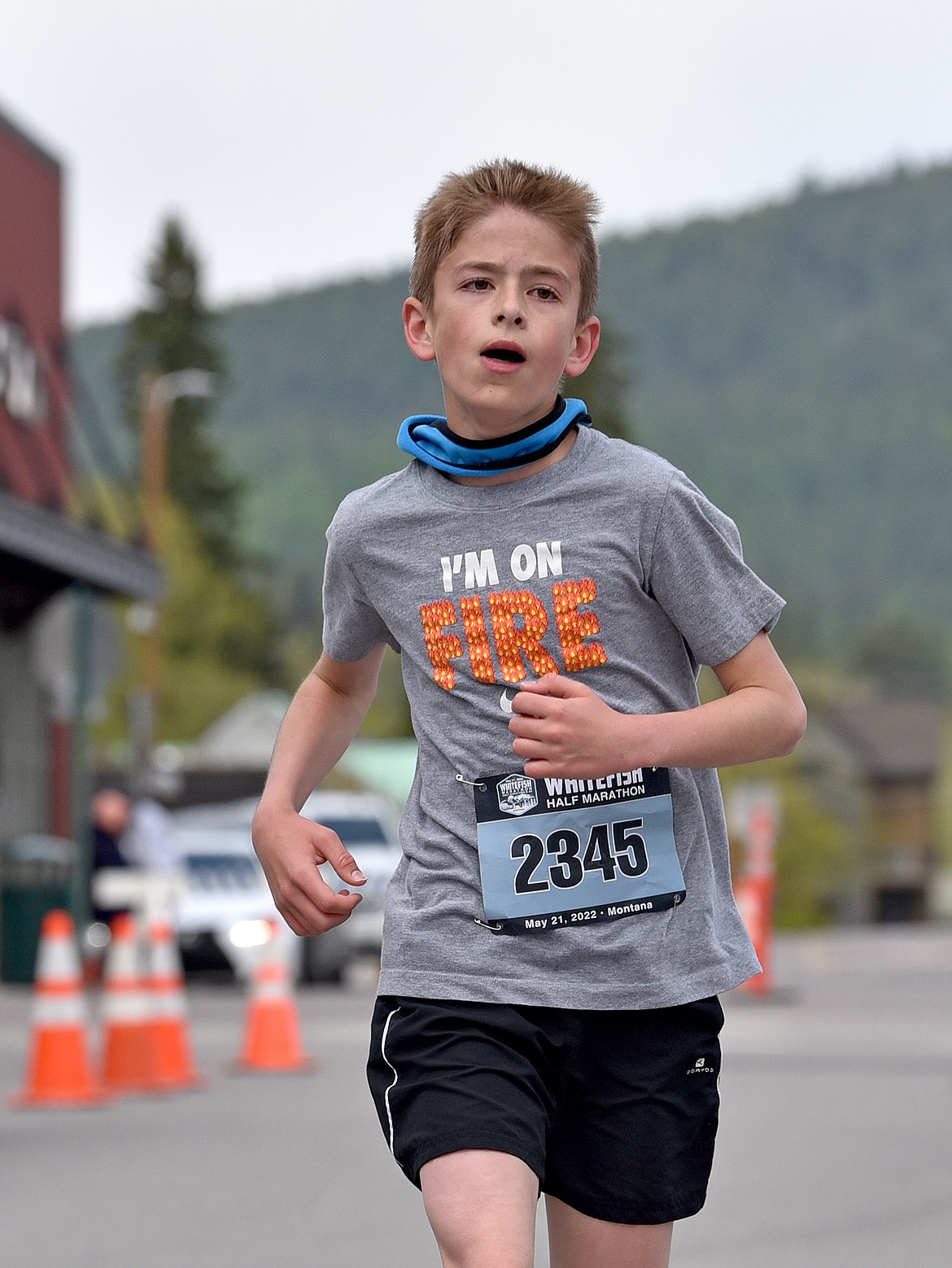 Carter Baum of Great Falls finishes first in the 12-19 age division in the Whitefish Half Marathon on Saturday. (Whitney England/Whitefish Pilot)