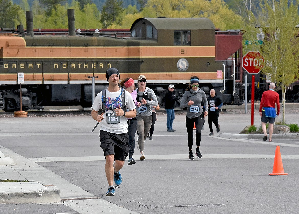 Racers run along Central Avenue during the Whitefish Marathon on Saturday. (Whitney England/Whitefish Pilot)