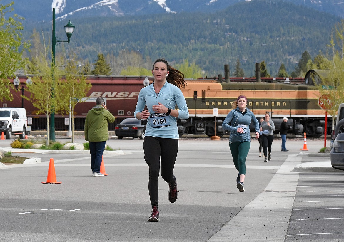 Runners along Central Avenue during the Whitefish Marathon on Saturday. (Whitney England/Whitefish Pilot)