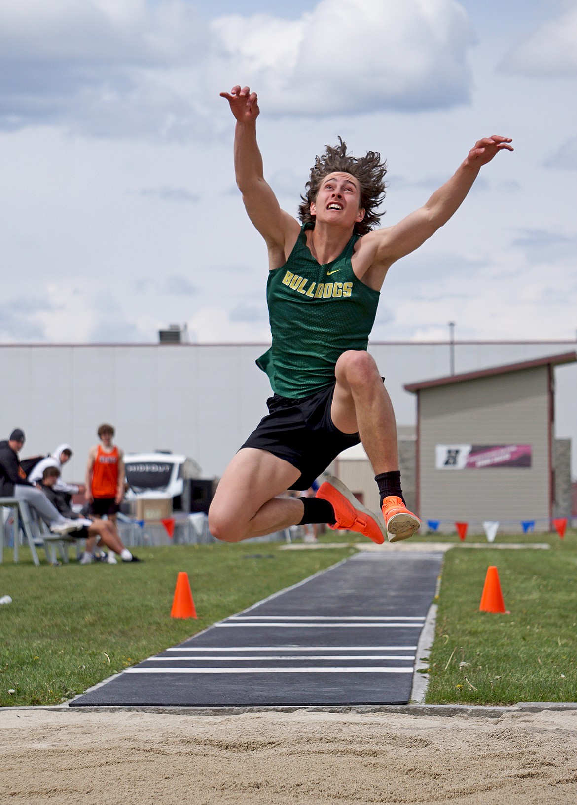 Bulldog senior Gabe Menicke leaps to first place in the triple jump at the Western A Divisional meet in Hamilton on Friday and Saturday. (Matt Weller photo)