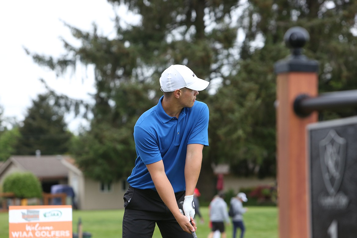 Othello’s T.J. Murdock tees off at the start of the boys 2A state tournament at Capitol City Golf Club in Olympia.