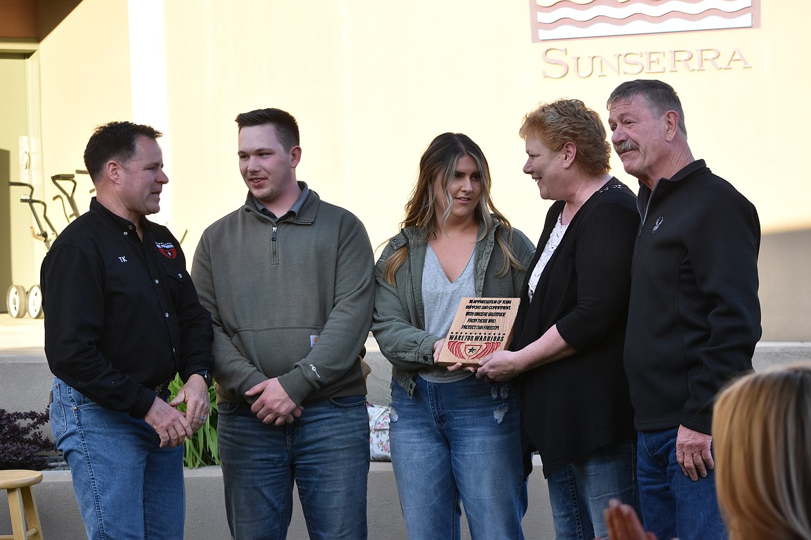 Wake For Warriors PNW chapter coordinator Terry Knight, left, presents Me2You Catering with a plaque for their support of the fundraiser on Saturday. Me2You Catering, based out of Wenatchee, donated food and services once they learned about the fundraiser.