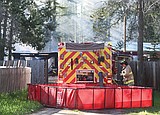 Firefighters douse garage fire